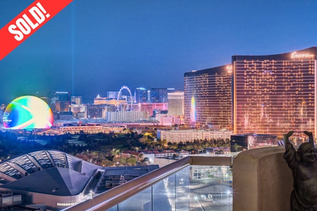 View from a sold corner penthouse at Turnberry Place Las Vegas overlooking the Las Vegas Strip with Wynn, Encore, the Sphere at night.